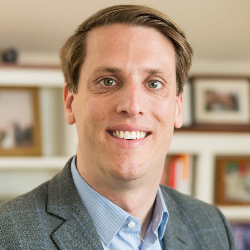 headshot of smiling commencement speaker Garrett Graff