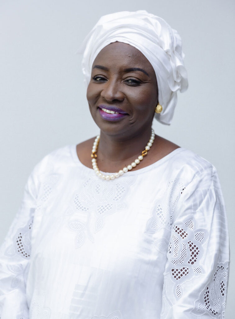 Headshot of Dr. Aminata Touré smiling, wearing all white